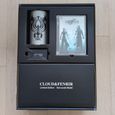A cup, the DVD, a Cloud figure and a jewel