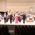 The composers, the singer and the conductor saluting the public