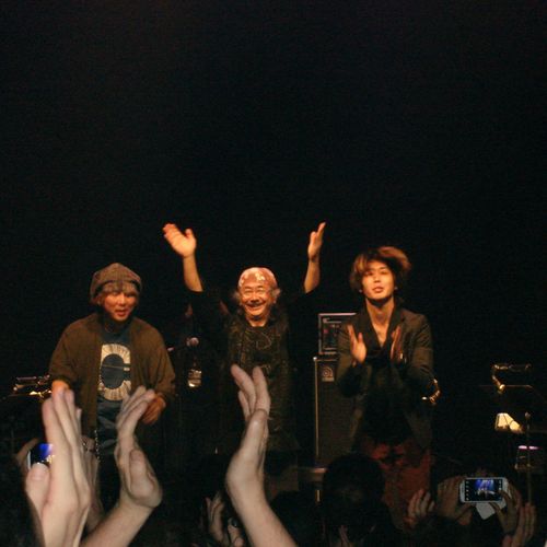 Nobuo Uematsu, Yoshitaka Hirota and Tsutomu Narita saluting the public