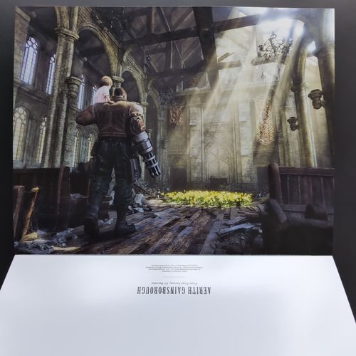 Two open pages from the inside of the book showing a poster of Barret and Marlene in Aerith's church.