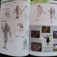 Two open pages from the inside of the book, showing artwork and memorable scenes featuring Vincent Valentine.
